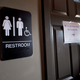 Unisex signage appears outside a bathroom at Bull McCabes Irish Pub in Durham, N.C., on May 10, 2016.
Sara D. Davis/Getty Images